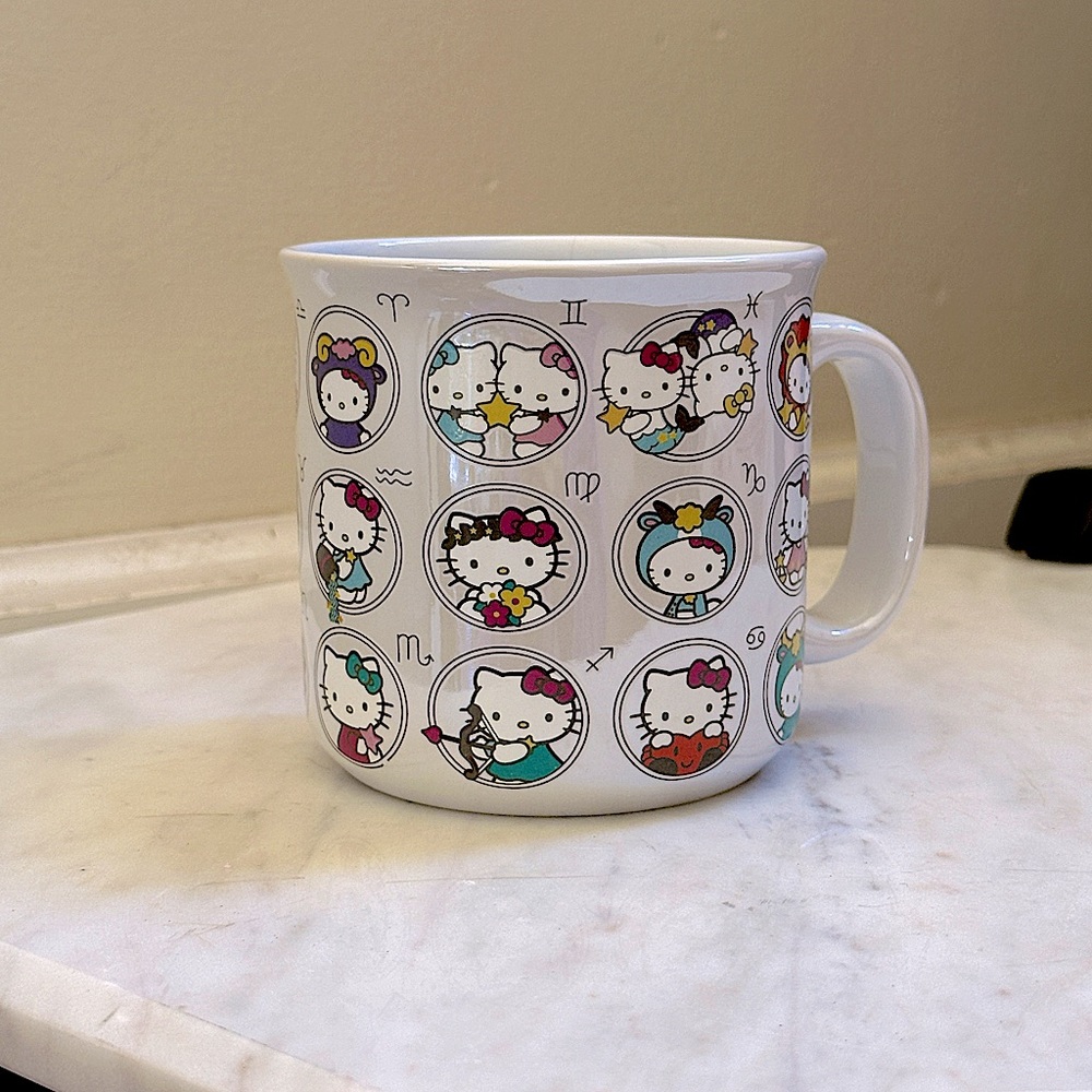 Box Lunch Sanrio Hello Kitty Zodiac Allover Print Camper Mug. 20oz.